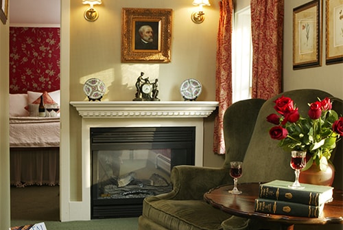 Eliza Jane Suite living room showing red roses and two reading chairs