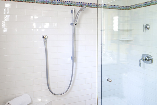 Garden Room guest bath shower with white tile and glass doors