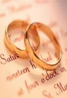 Close-up view of two gold wedding rings