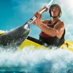 A man paddling in a kayak