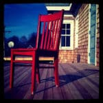 Red wooden chair on the deck