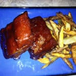 Blue plate of BBQ ribs and homemade French fries